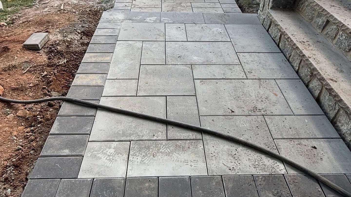 Poured Concrete Entry Walkway with Cobblestone Edging
