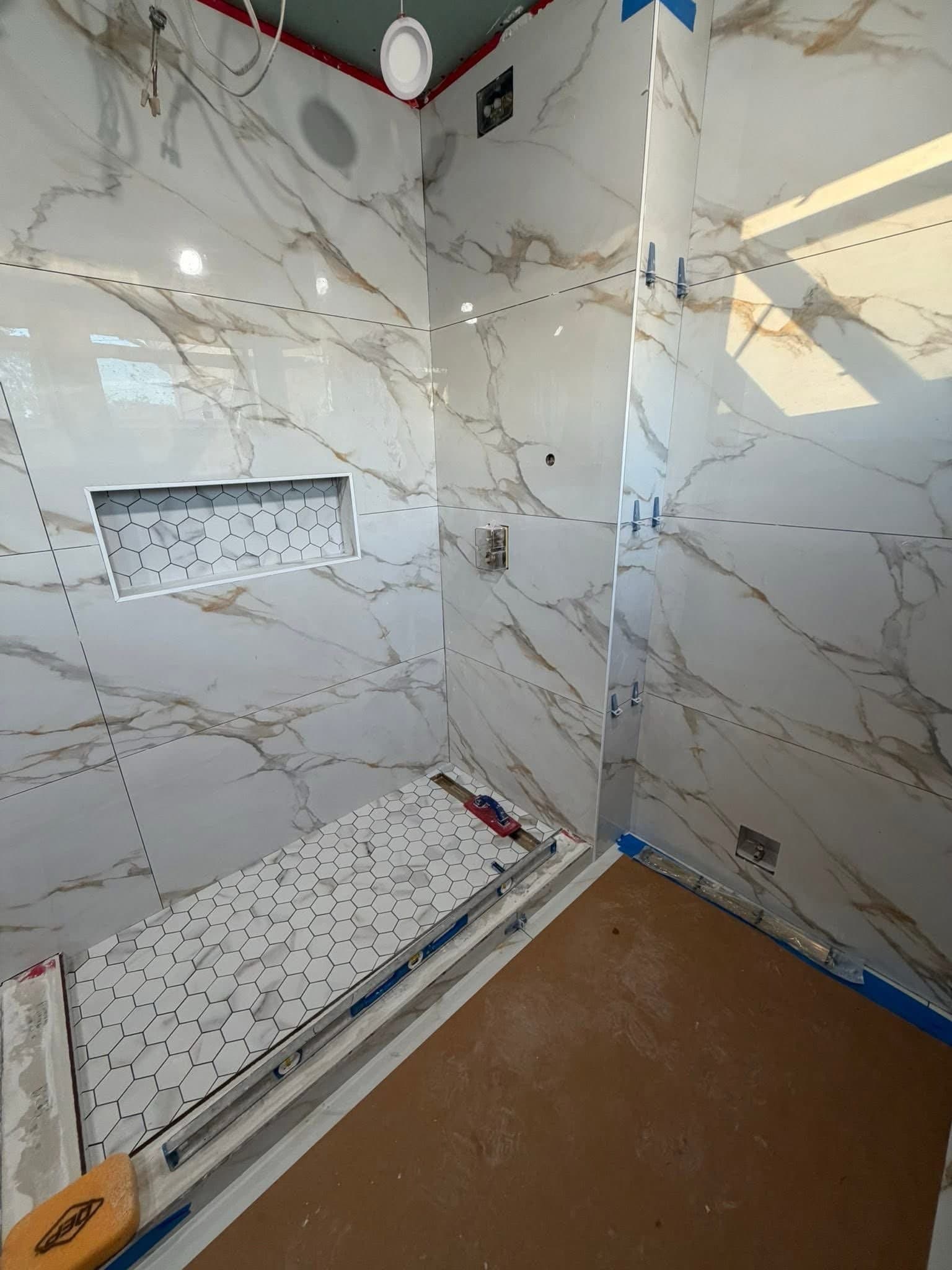 Polished Crema Marfil Porcelain Bathroom Remodel